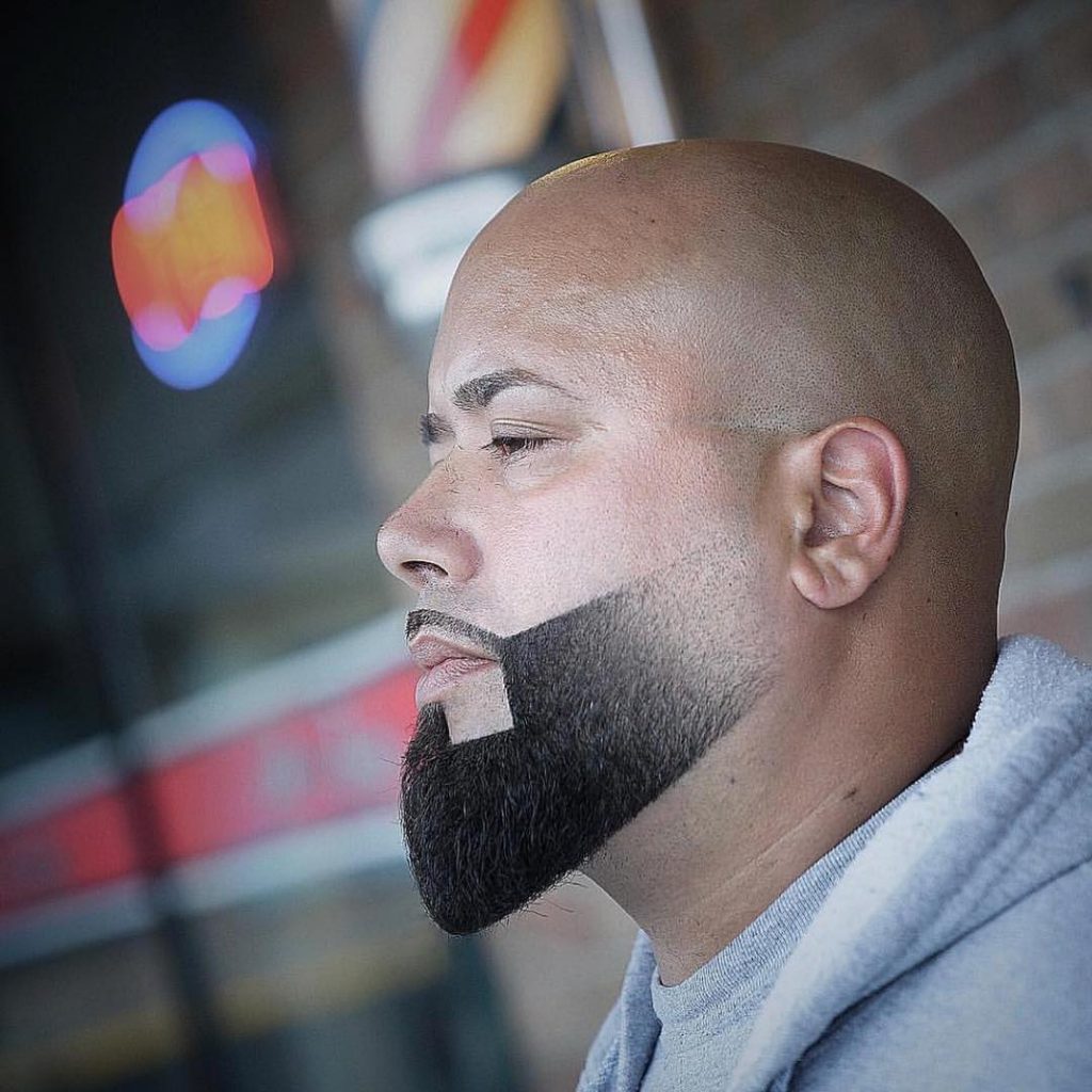 Trimmed styled beard with bald head